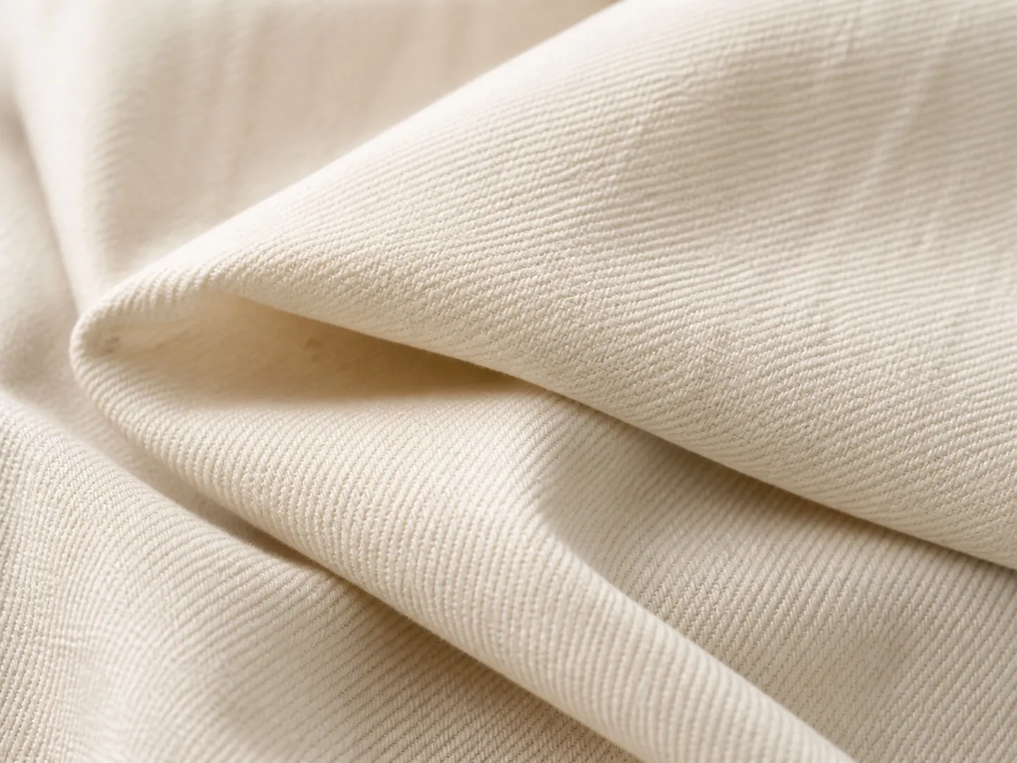 Close-up of naturally woven off-white cotton fabric