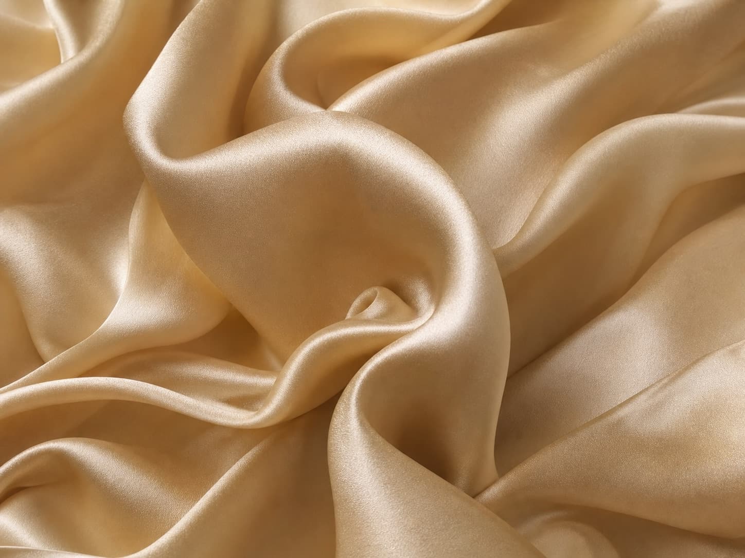 Close-up of lustrous champagne silk fabric